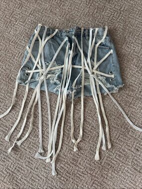 Distressed Light Blue Denim Shoe Lace Grommet Fringe Shorts